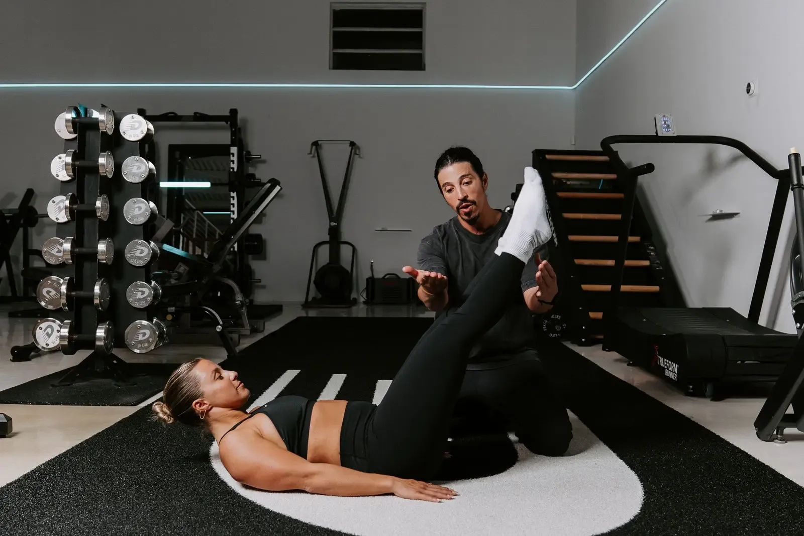 Girl with trainer doing core work