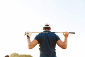 back of male golfer on golf course
